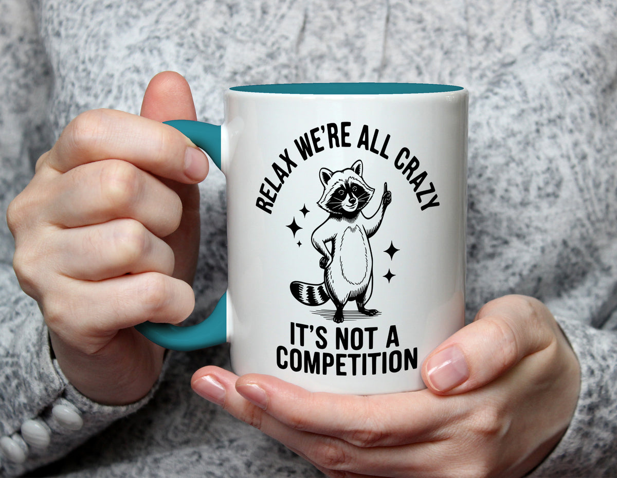 RELAX WE'RE ALL CRAZY IT'S NOT A COMPETITION - Funny Raccoon Mug - Light Blue